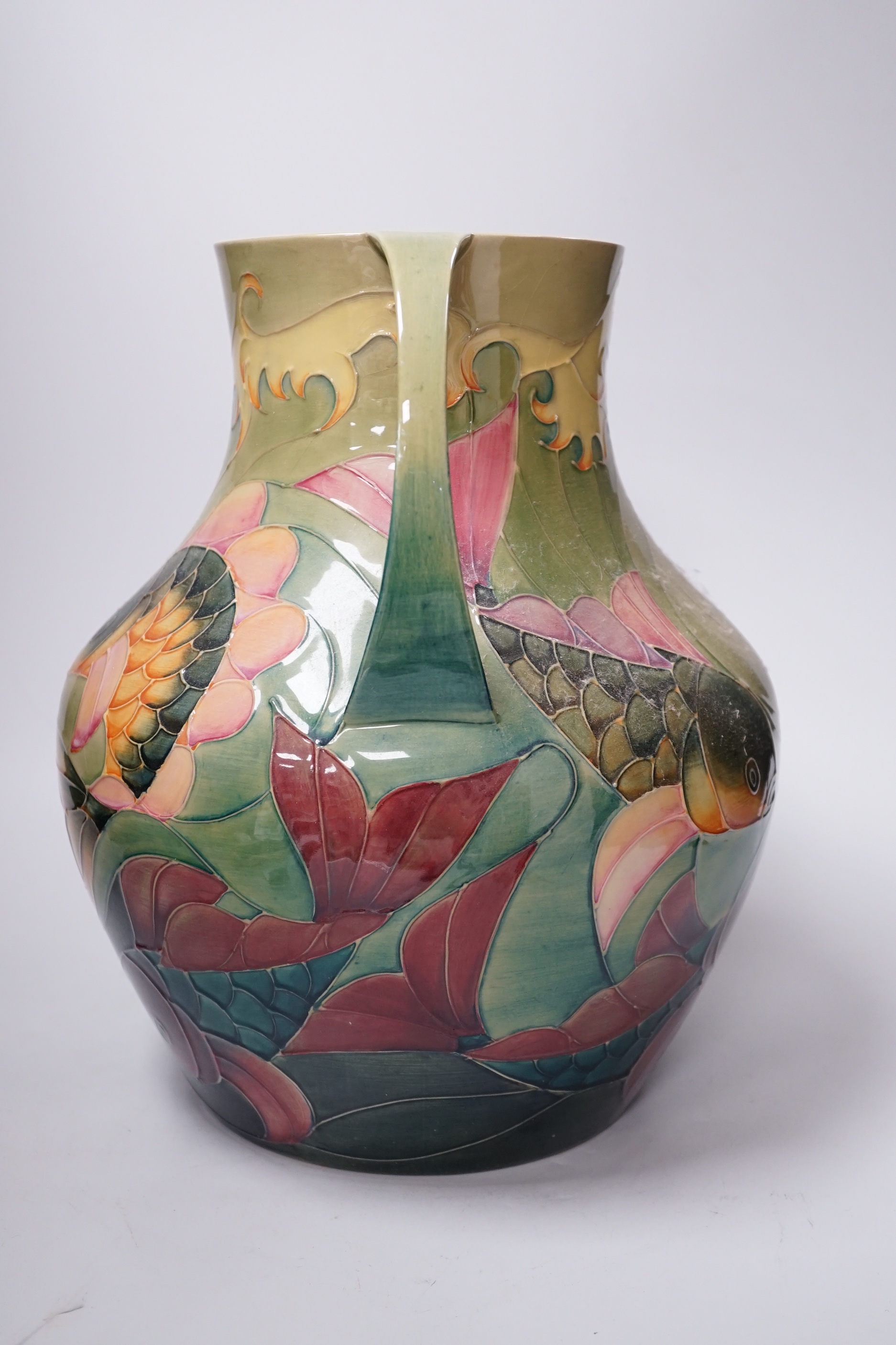 Large Moorcroft ‘Carp’ vase with twin handles designed by Sally Tuffin decorated with carp, 33cm high